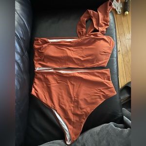 One piece rust colored bathing suit